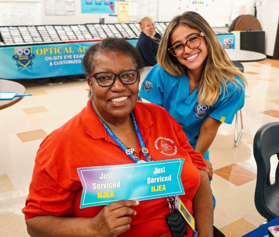 Optical Academy team member with an educator at an onsite event